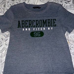 It’s a gray and green t-shirt has been worn once!